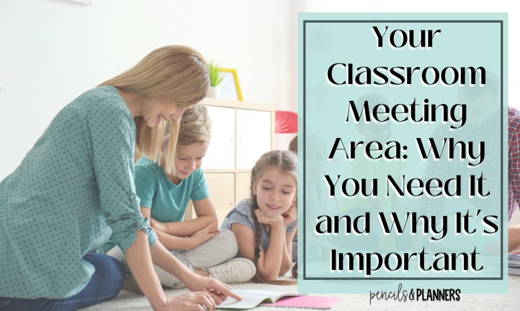 teacher pointing to student work with 2 students listening intently text overlay says Your Classroom Meeting Area: Why You Need It and Why It’s Important